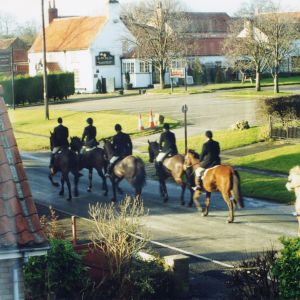 Horses and riders near Ye Old Sun Inn