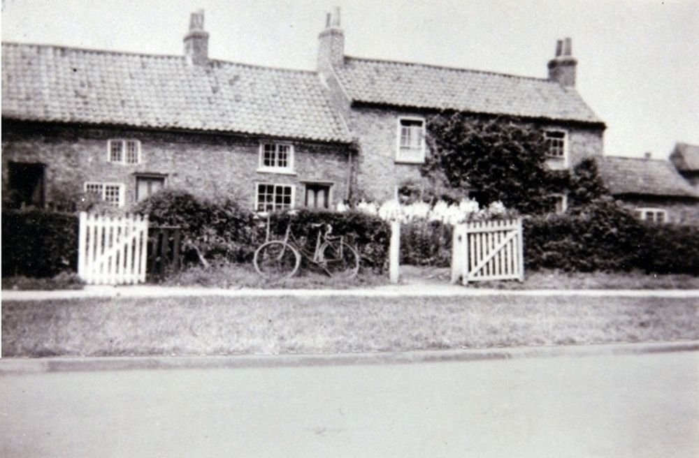 Cottages on Main Street with bicycle outside