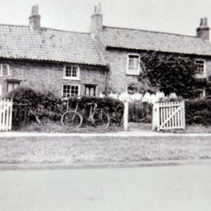 Cottages on Main Street with bicycle outside